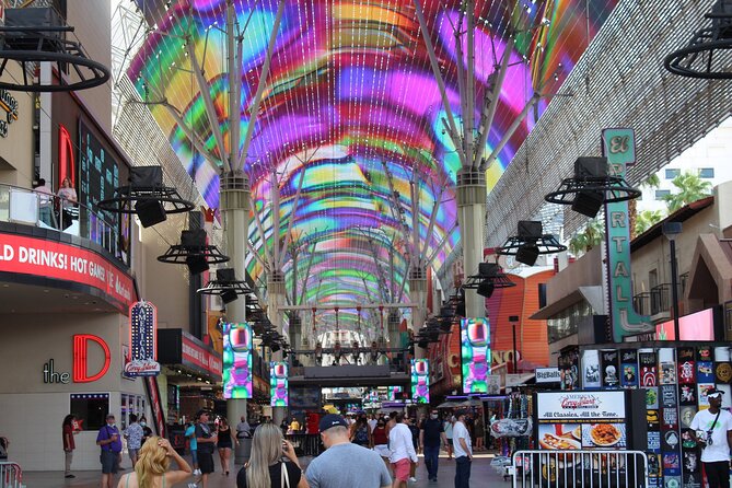 Best Bars on Fremont: Happy Hour and Hidden Gems - Crossing Fremont Street beneath Viva Vision