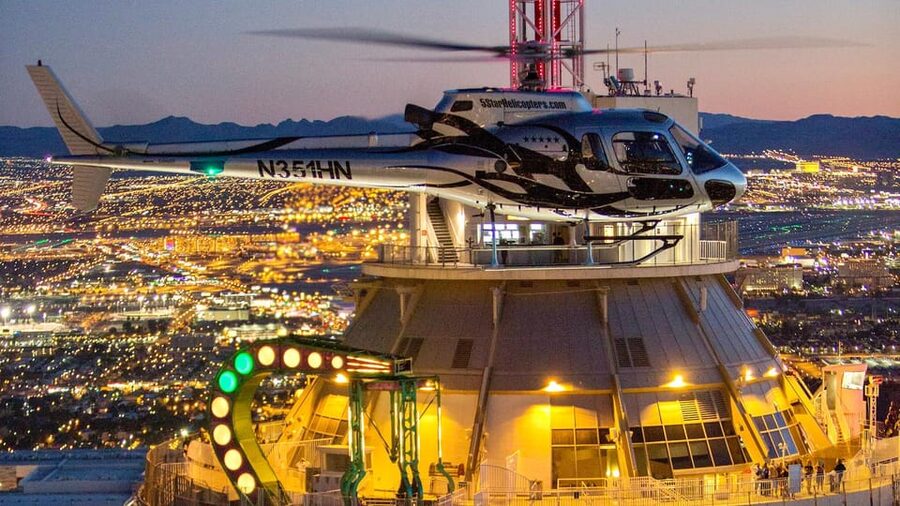 Las Vegas: Nighttime Helicopter Flight over the Strip - The Strip takes shape below you