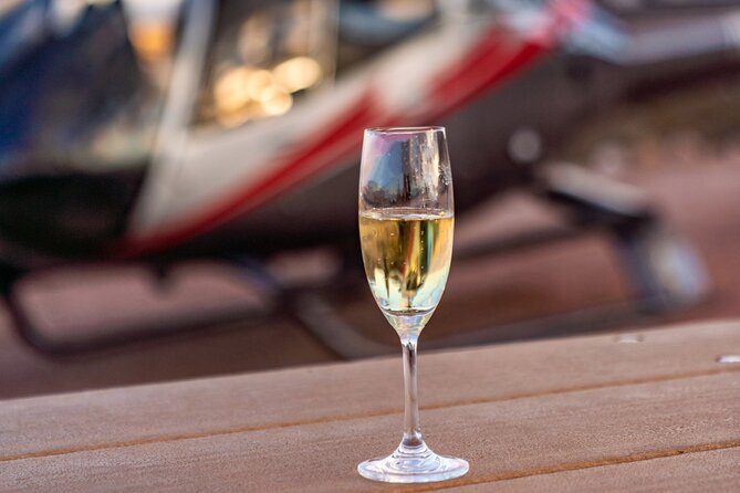 Red Rock Canyon Helicopter Tour with Landing and Champagne Toast - Returning over Bellagio, Luxor, and Allegiant Stadium